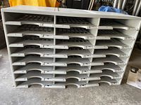 Front view showing 24 individual compartments numbered 1 to 24 with black marker.