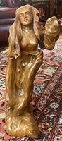 Full view of carved wooden mermaid sculpture