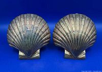 Front view of both shell-motif bookends