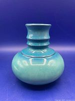 Front view of turquoise Jasba bottle vase