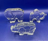 Group shot showing elephant, camel and rhinoceros glass figurines