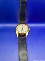 Full view of oversized watch showing strap and case