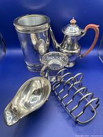 Group shot of all five silver plate items