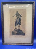 Full view of framed photogravure showing frame, mat and hanging hook