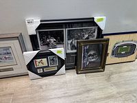 Five framed sports memorabilia pieces shown together with visible sizes and frame styles