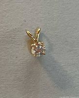 Front view of 14K gold diamond pendant