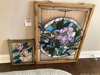 Front view of both stained glass panels showing designs and frames