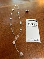 Necklace, ring, lot tag overview