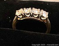 Front view of diamond ring showing four stones