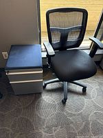 Chair and file cabinet side by side