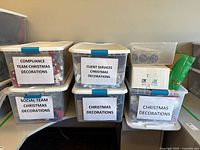 Six labeled totes on desktop