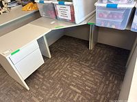 Overall view showing three desk pieces assembled in corner configuration with attached pedestal