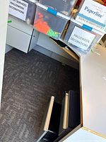 Overview of L-shaped desk, laminate top, pedestal under return