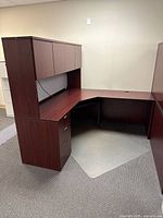 Front view of L-shaped desk with hutch and pedestal