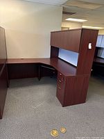 Full view of L-shaped desk showing hutch and pedestal