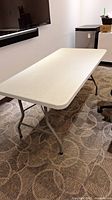 Table assembled showing top surface and legs