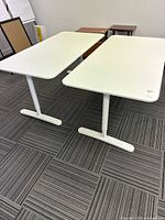 Both Bekant tables side by side, showing tops and legs