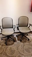 Front view of both mesh swivel chairs