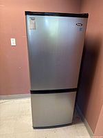 Full frontal view of stainless Danby refrigerator