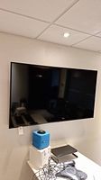 Front view of Samsung flat screen TV on wall