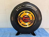 Front view of closed tire-shaped Hot Wheels Super Rally case