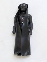 Full view of Darth Vader figure with cape