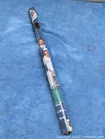 Rolled poster sealed in plastic showing team imagery