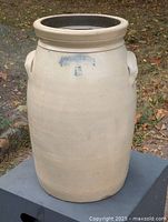 Front view showing full churn, handles, and missing lid