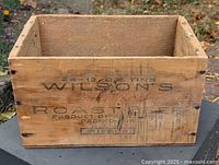 Front view of wooden Wilson's Roast Beef crate with open top
