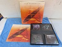 Front of boxed set with slipcase, fold-out case and CDs visible