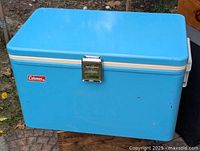 Front and top view of baby blue Coleman cooler showing overall condition