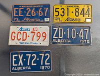 All five Alberta license plates laid out