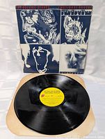 Front view of album sleeve with record displayed
