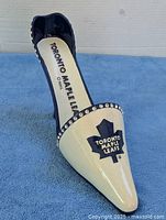 Full view of stiletto wine holder, logo visible