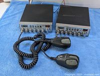 Two Cobra CB radios with microphones