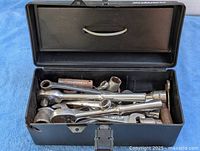 open toolbox showing ratchets, sockets, extensions