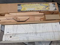 Open box with balsa parts and hardware compartment