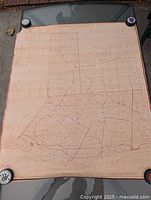 Entire map laid out flat, four weights on corners