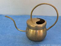 Full view right side showing spout, handle and body