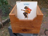 Front view of pine LP box with record for scale