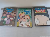 Front view of three Family Guy DVD cases