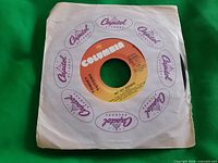 Record in Capitol sleeve showing A-side label