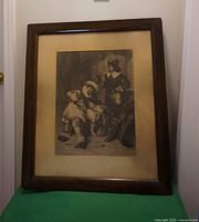 Full view of framed print on stand