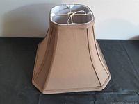 Full view of brown rectangular bell-style lamp shade front