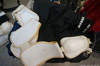 Itech HP 6000 pants with white shoulder pads on top
