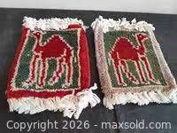 Front view of both woven camel motif coasters
