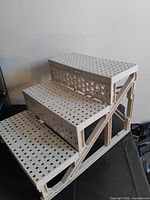 Right side view showing three perforated steps and side bracing