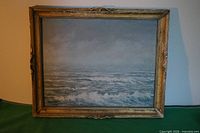 Front view of framed seascape painting