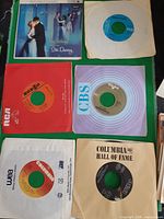 All six 45 RPM records with sleeves visible