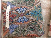 Folded fabric piece with tape label showing dimensions 54" x 43"